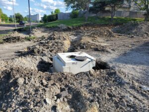 New parking lot storm drain receiver (South)